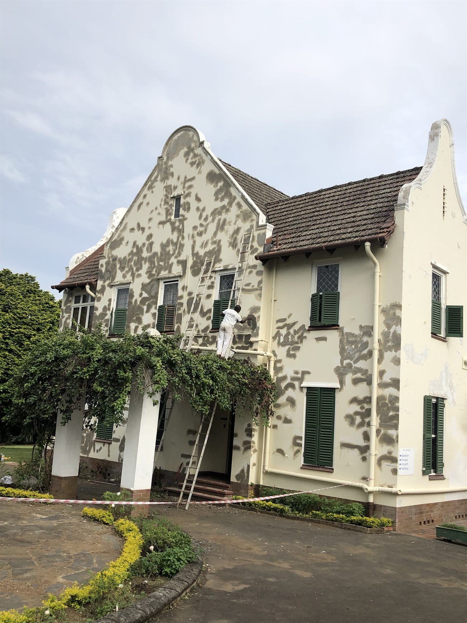 Heritage building exterior before repaint - blistered paint