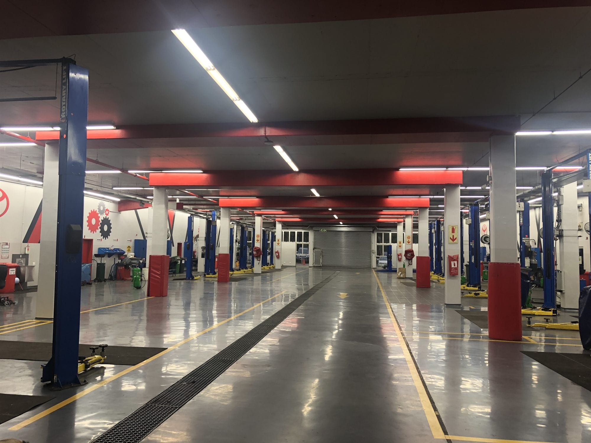 Commercial vehicle workshop after internal repainting, with a sealed floor