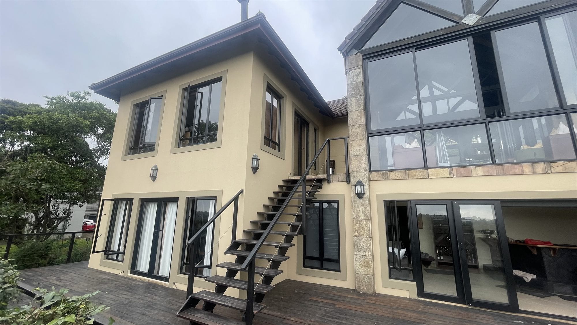 Double-storey estate home exterior - high-level painting and finishing work